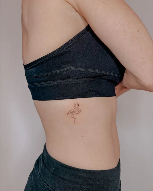 Tiny Fine Line Flamingo Tattoo on Women Rib by @_kegs_