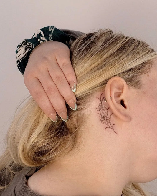 Tiny Fine Line Flower Women Behind the Ear Tattoo on Women Behind the Ear by @madisonbloom.ink