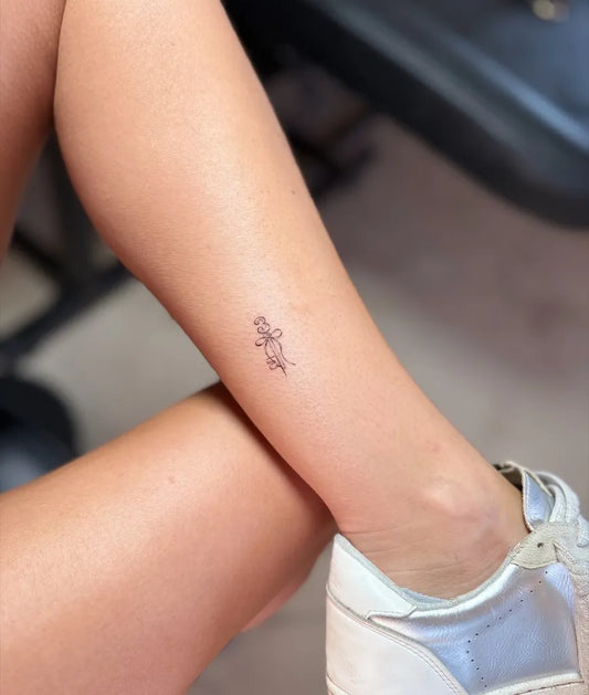 Tiny Fine Line Flower on Women Leg Tattoo by @inkwithchristian