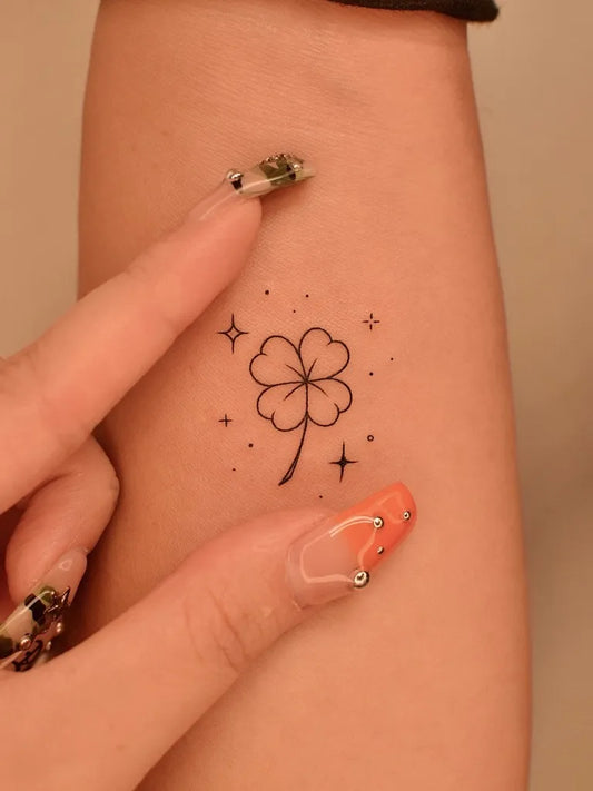 Tiny Fine Line Four Leaf Clover with Stars on Women Arm Tattoo by @tattooer_jina