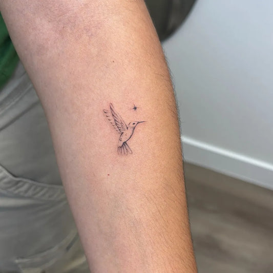 Tiny Fine Line Hummingbird on Women Arm Tattoo by @inklore_mk