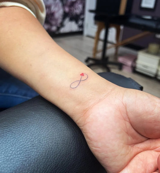 Tiny Fine Line Infinity Symbol on Women Wrist Tattoo by @nashbrows615