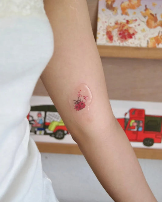 Tiny Fine Line Ladybug Tattoo on Women Arm by @hbd24_7