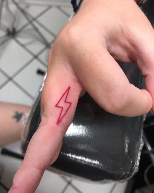 Tiny Fine Line Lightning Bolt Tattoo on Women Hand by @hollywoodnt420