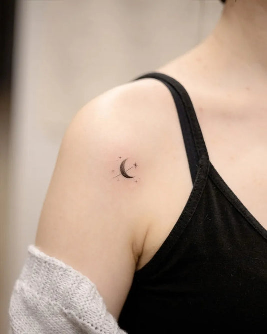 Tiny Fine Line Moon Tattoo on Women Shoulder by @handitrip