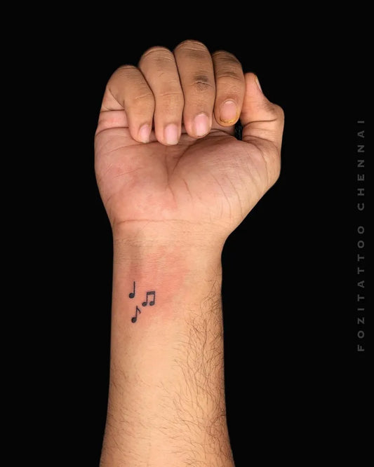 Tiny Fine Line Music Notes Music Tattoo on Men Wrist by @fozitattoo