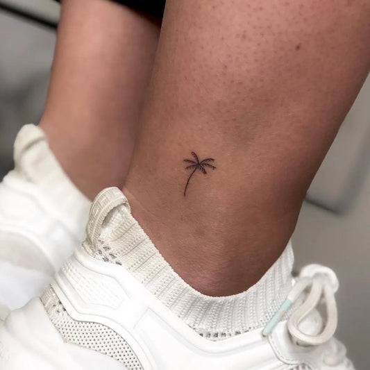 Tiny Fine Line Palm Tree Tattoo on Women Ankle by @mcmascha