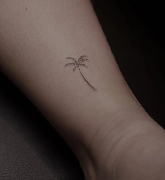 Tiny Fine Line Palm Tree Tattoo on Women Ankle by @pure.ttt
