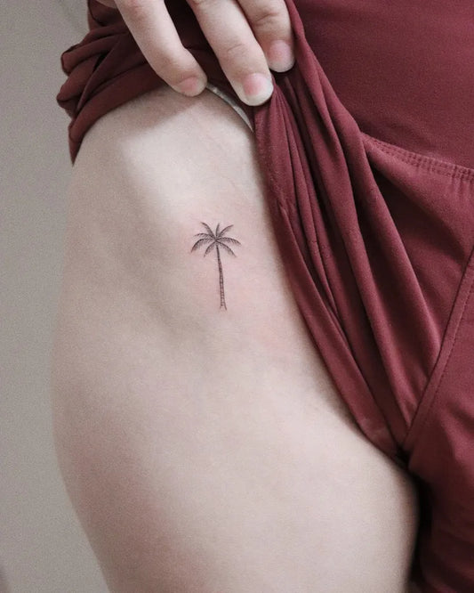 Tiny Fine Line Palm Tree Tattoo on Women Hip by @inkmyth_tattoo