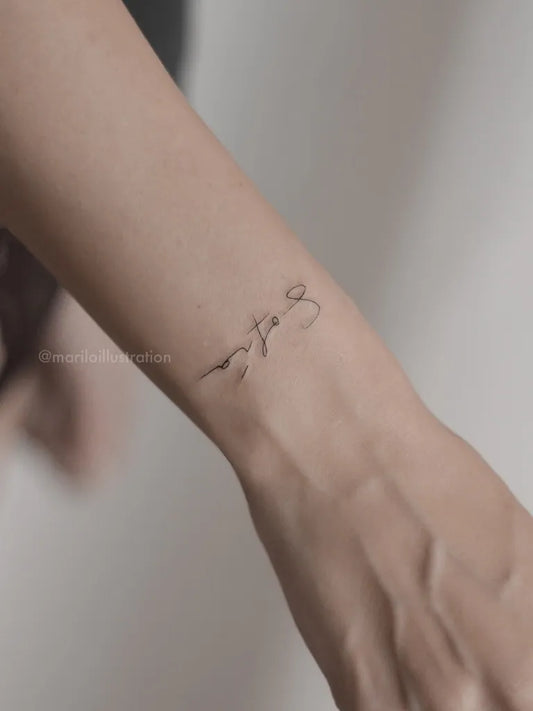 Tiny Fine Line Script Quote Tattoo on Women Wrist by @mariloillustration