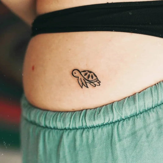 Tiny Fine Line Sea Turtle Tattoo on Women Hip by @tinytattoos_feathertouch