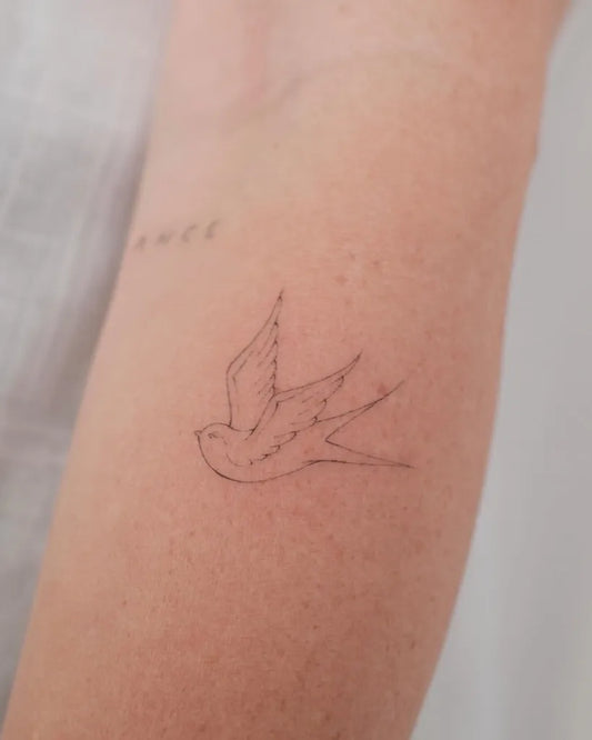 Tiny Fine Line Swallow Bird Dots on Women Arm Tattoo by @uv.tattoo