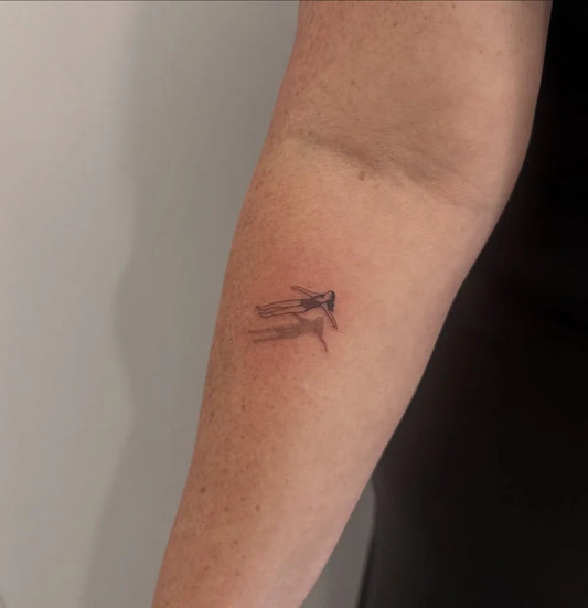 Tiny Fine Line Swallow Shadow on Women Arm Tattoo by @finelinetattoosperth