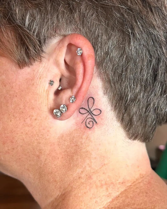 Tiny Fine Line Symbol Tattoo on Women Behind the Ear by @heroicink