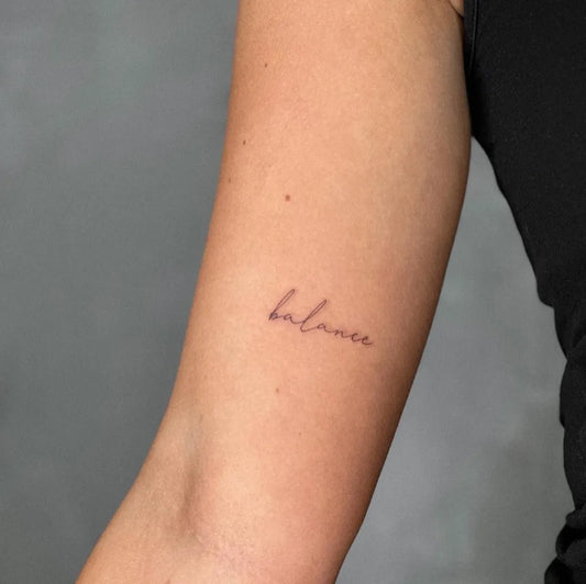 Tiny Fine Line Word Tattoo on Women Arm by @tattoosbyjus