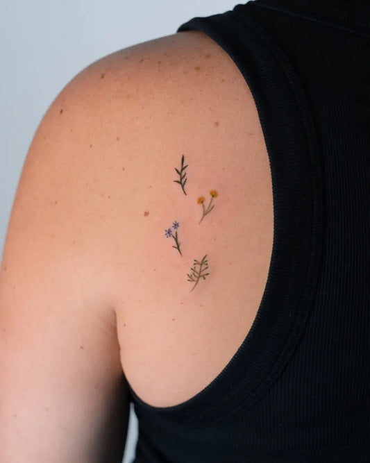 Tiny Fine Line small flowers and leaves on Women Shoulder Tattoo by @jennstatt