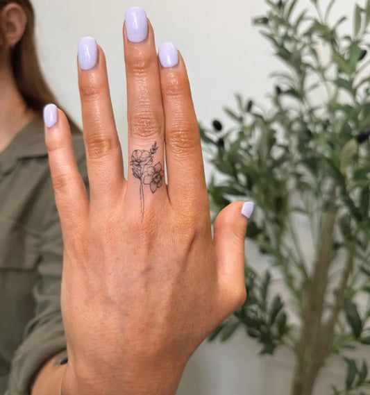 Tiny FineLine Flower on Women Fingers Tattoo by @lunarfinelineink