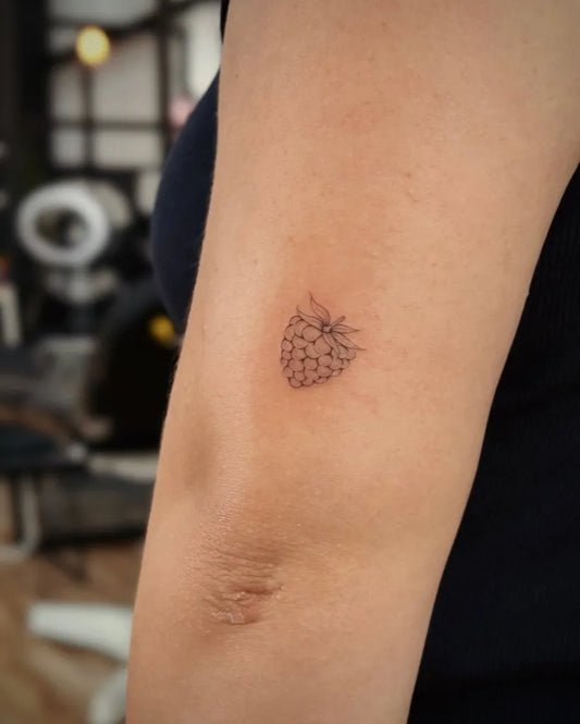Tiny FineLine Strawberry on Women Arm Tattoo by @blackpear_ink