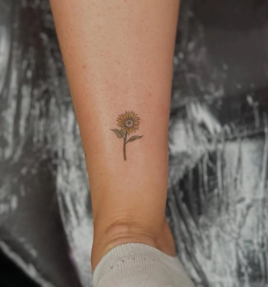 Tiny FineLine Sunflower on Women Ankle Tattoo by @finelinetattoo_london
