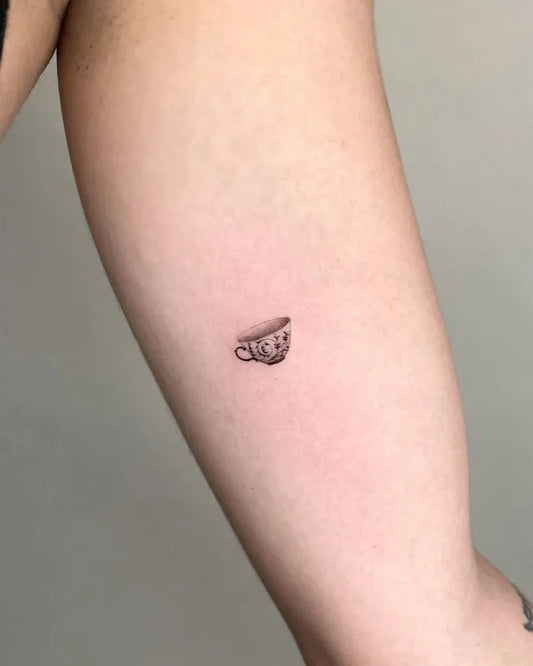 Tiny FineLine Teacup on Women Arm Tattoo by @xxs.tattoos