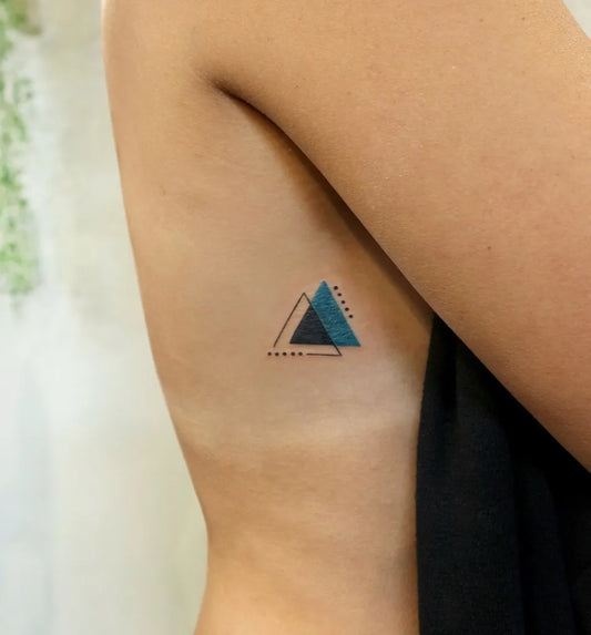 Tiny Geometric Triangles on Women Rib Tattoo by @rolypolyc