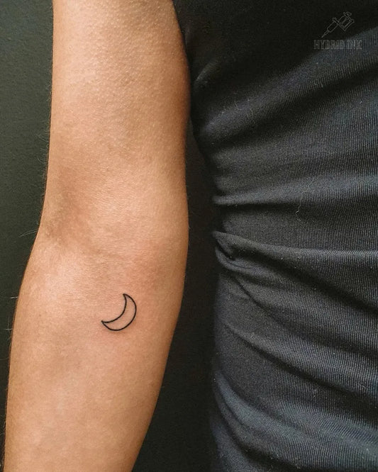 Tiny Linework Crescent Moon Tattoo on Women Arm by @hybridink.helsinki