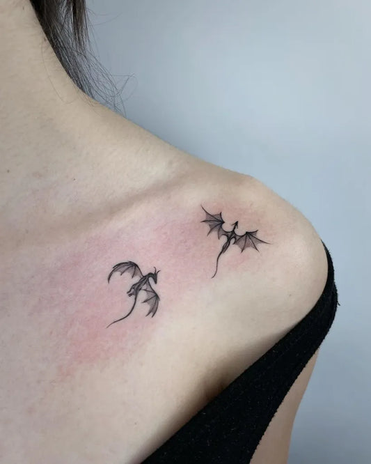 Tiny Linework Dragons on Women Shoulder Tattoo by @ambertattooer
