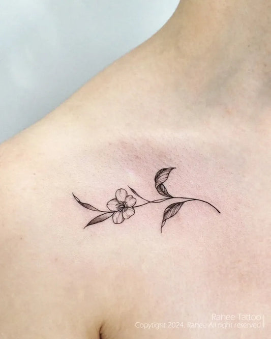 Tiny Linework Flower and Leaves Tattoo on Women Collarbone by @rahee.tt