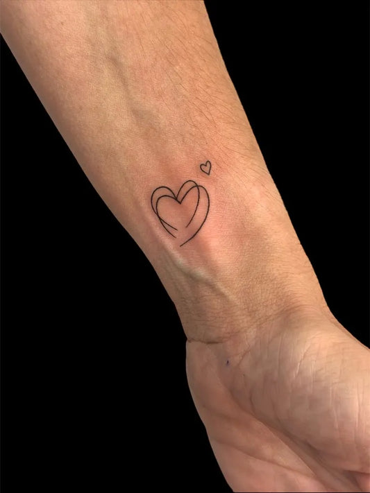 Tiny Linework Heart and Small Heart on Women Wrist Tattoo by @lunacora_tattoo