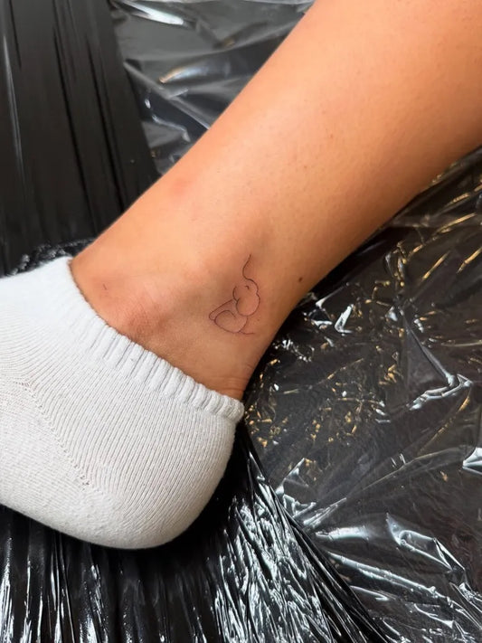 Tiny Linework Heart on Women Ankle Tattoo by @alexandreasartistry