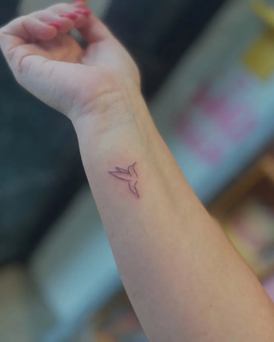 Tiny Linework Hummingbird on Women Wrist Tattoo by @samsamsawyer