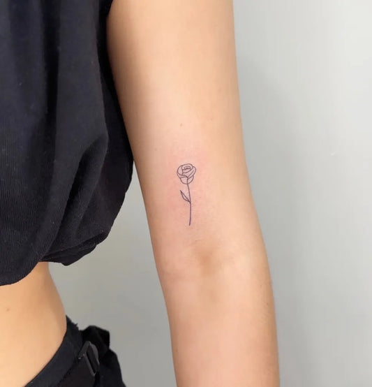 Tiny Linework Rose on Women Arm Tattoo by @esthete__studio