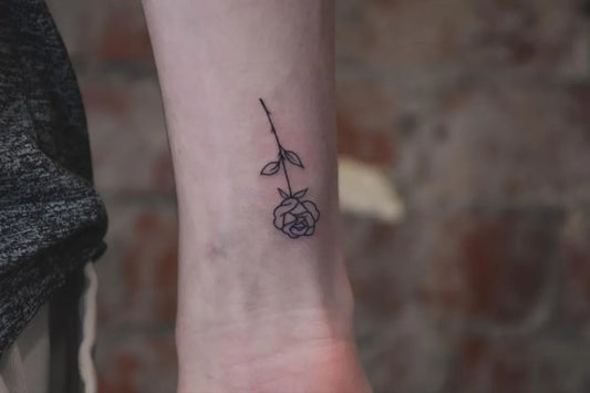 Tiny Linework Rose on Women Wrist Tattoo by @la.rue.gallery