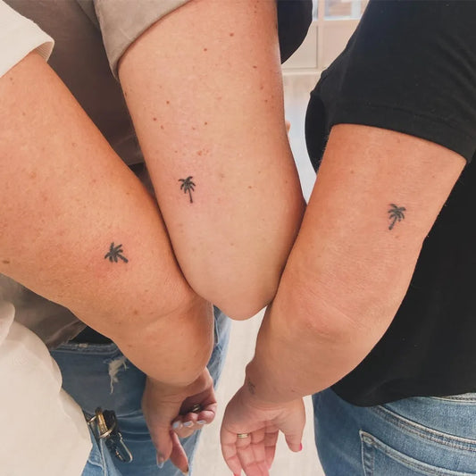 Tiny Matching Friendship Palm Tree Tattoo on Women Arm by @tinytattoofairy