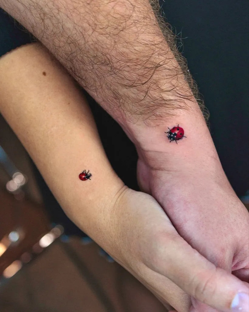 Tiny Matching Ladybug Couple Tattoo on Women Forearm by @ssuncolor