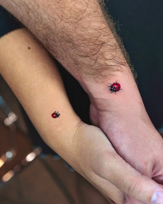 Tiny Matching Ladybug Couple Tattoo on Women Forearm by @ssuncolor