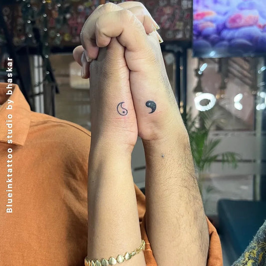 Tiny Matching Yin Yang Tattoo on Women Wrist by @blueinktat2