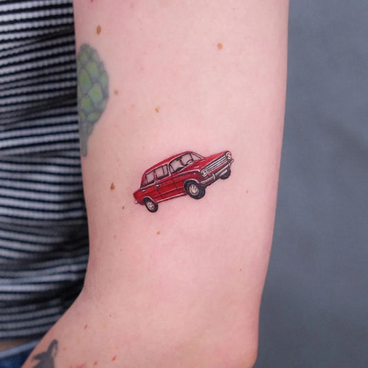 Tiny Micro Realism Flying Red Car on Women Arm Tattoo by @kikimorryy