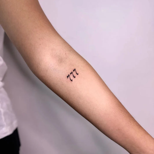 Tiny Minimalist 777 Tattoo on Women Arm by @yellowltattoos