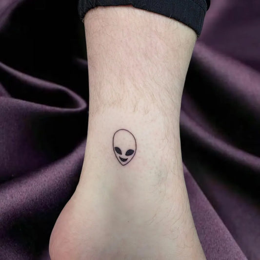 Tiny Minimalist Alien Tattoo on Women Ankle by @dollietattoos
