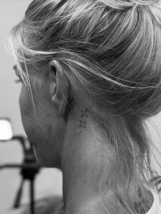 Tiny Minimalist Arrow Tattoo on Women Behind the Ear by @dr_g_tattoo_hurghada
