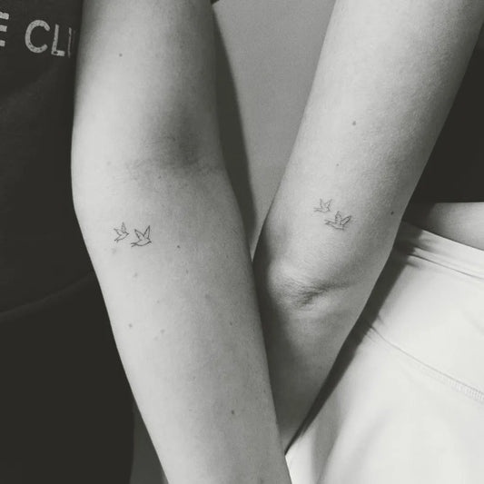 Tiny Minimalist Birds on Friends Arms Matching Tattoo by @v.withlove