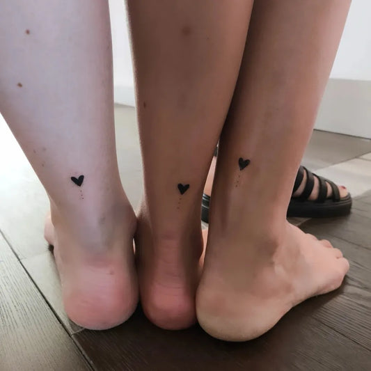 Tiny Minimalist Black Hearts on Friends Ankles Matching Tattoo by @alex.ink.uk