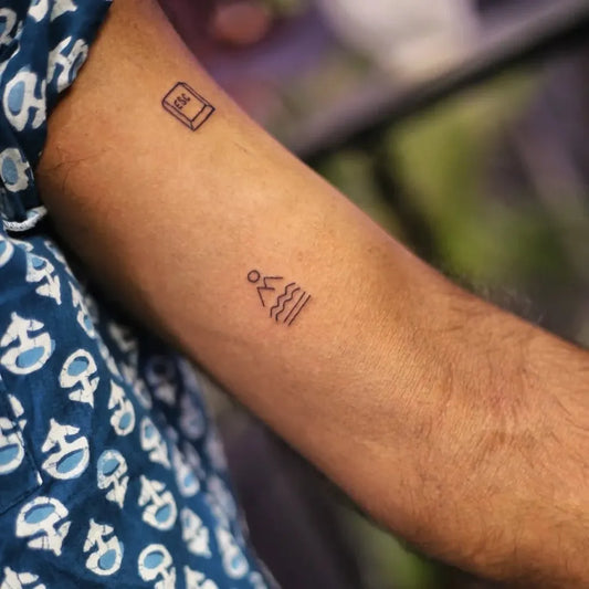 Tiny Minimalist Book and Hiker Tattoo on Men Bicep by @tamannainks