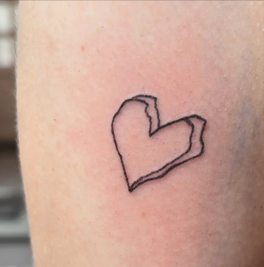 Tiny Minimalist Broken Heart on Women Arm Tattoo by @schurii_
