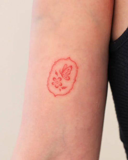 Tiny Minimalist Butterfly on Women Upper Arm Tattoo by @oats.tattoo