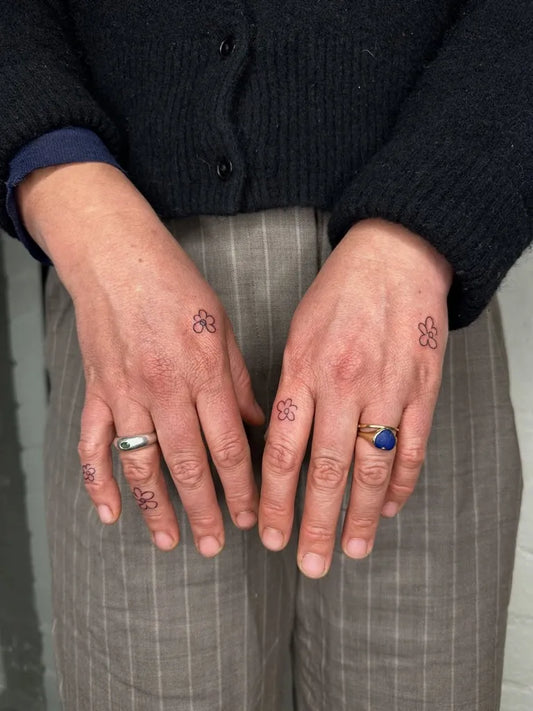 Tiny Minimalist Cherry Blossom on Women Hands Tattoo by @everyday_lines_