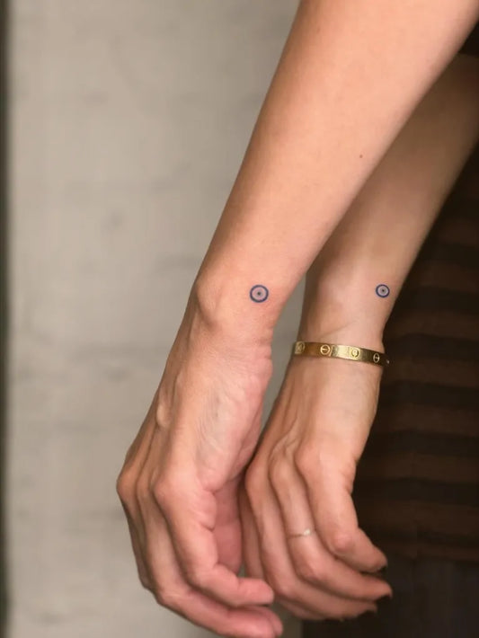 Tiny Minimalist Circles on Couple Wrists Matching Tattoo by @tattoovasquez