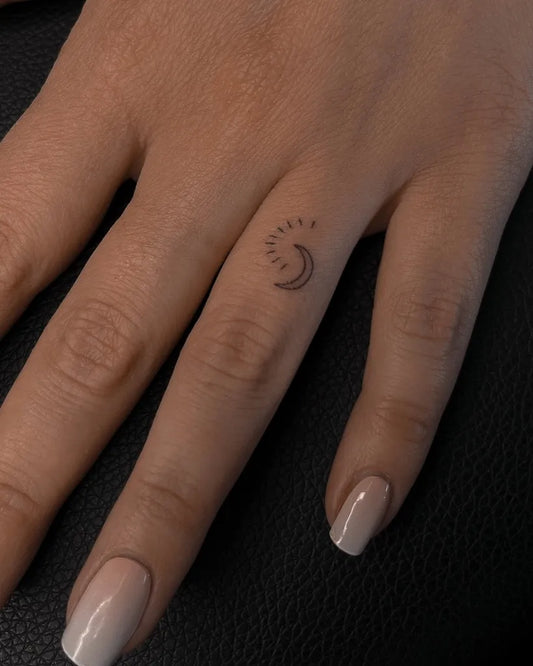 Tiny Minimalist Crescent Moon on Women Fingers Tattoo by @sandpoke.ink