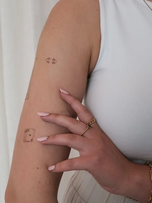 Tiny Minimalist Dice and Hashtags on Women Arm Tattoo by @tattoos30kmh